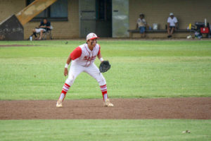 A Kalani baseball player waits in the outfield. 