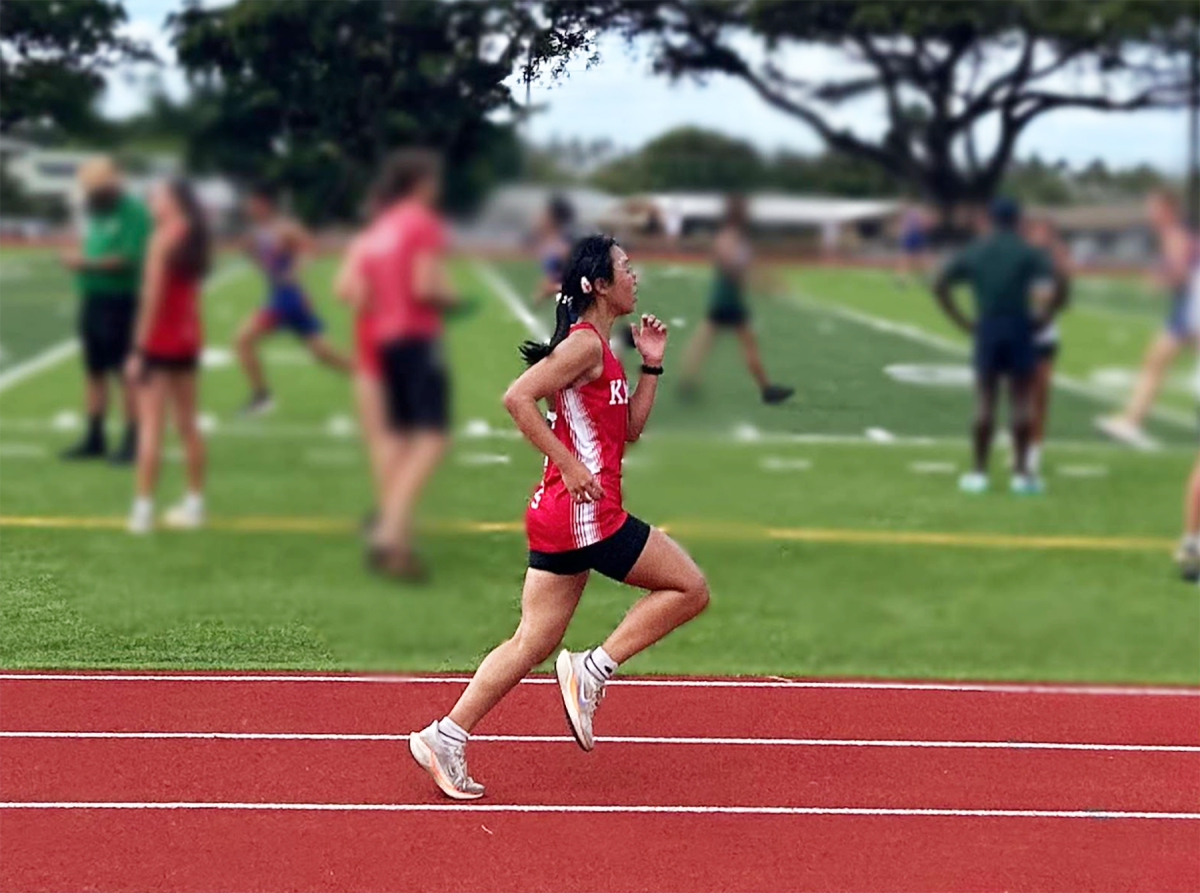 Annilis Ung (10) sprints to the finish line in the 5 kilometer race at the Kalani Invitational on Sept. 28. This was the first time new Kalani track and field was used for an official sporting event. 