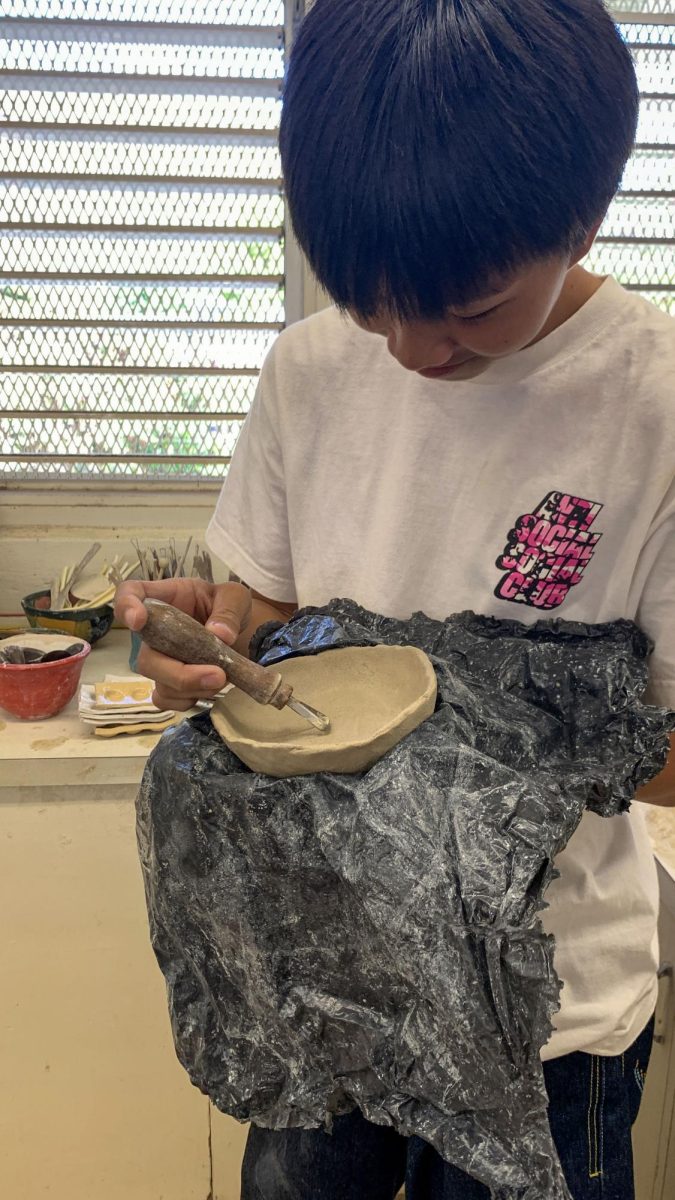 Kellen Kobayashi (10) creates a plate in ceramics class that he will be using to hold miscellaneous items. 