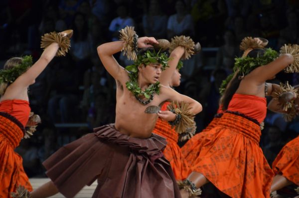 Hula kahiko dancers from Hālau o Kekuhi on stage at the Merrie Monarch Festival.